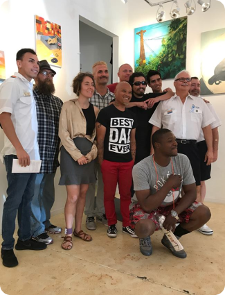 a group of people smiling with a person in front wearing a shirt that says "Best Day Ever"