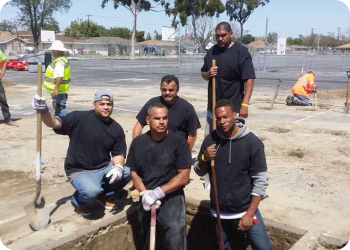 A group of volunteers holding shovels